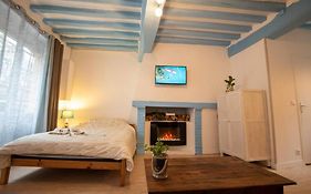 Blue Appartment With A Fireplace